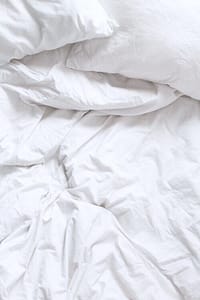 how to maintain bright white bed sheets